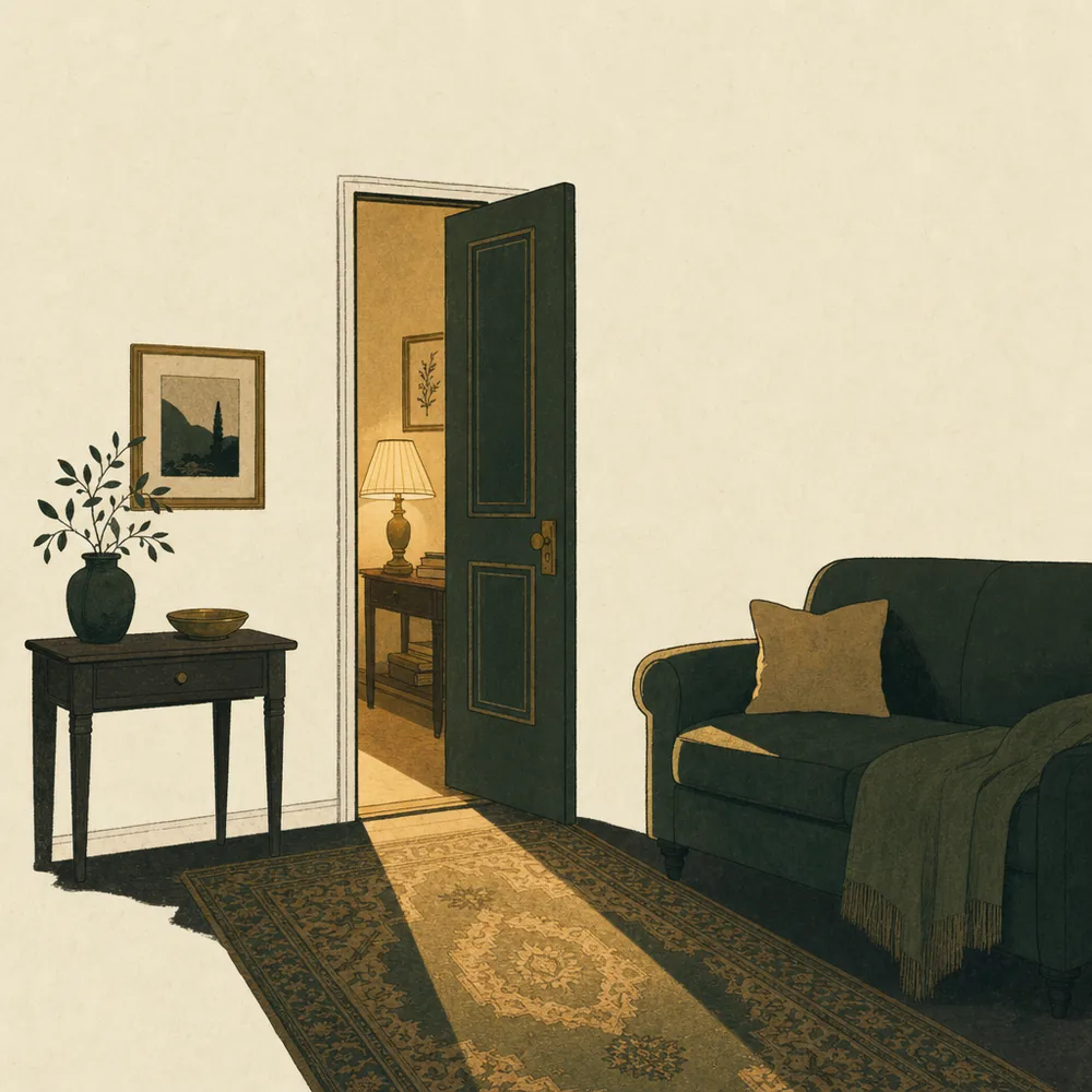 A half-open doorway with warm light falling in a stripe across a rug